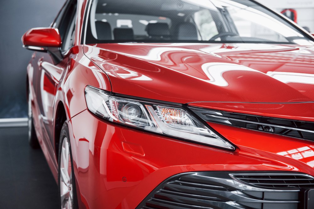 headlights-new-red-car-car-dealership